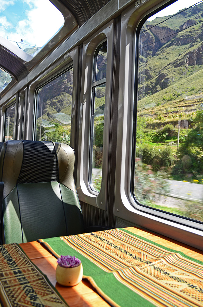 Scenic panoramic train with large windows traveling toward Aguas Calientes