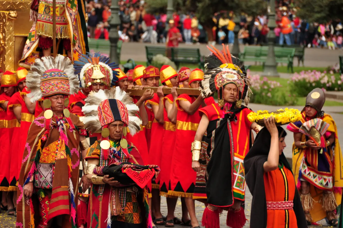 Inti Raymi ceremony performers in traditional red costumes at Plaza de Armas, Cusco