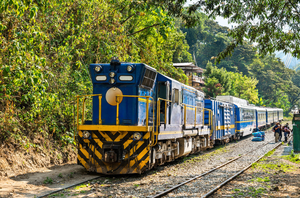 Train passing through the Sacred Valley on the route to Machu Picchu, Peru